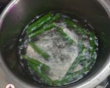 A picture of step 1 of Saragava Bateta nu Shak (drumstick potato curry).