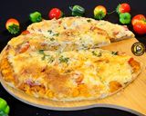A picture of step 7 of Cheese Burst Veggies And Chicken Pizza From Scratch.
