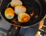 A picture of step 1 of Boiled eggs pan fried WD tumeric powder.