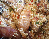 Foto del paso 5 de la receta: Arroz caldoso con conejo y setas aromatizado con perejil y romero