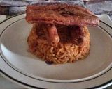 A picture of step 3 of Jollof rice with sausage.