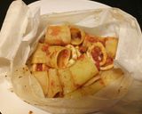 A picture of step 6 of Mezzi paccheri con calamari al cartoccio.