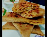 A picture of step 13 of Veg Mughlai Paratha with lacha pyaz and Dahi.