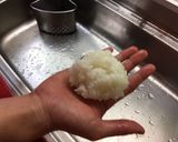 A picture of step 2 of Rice ball (onigiri).