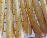 A picture of step 3 of Cacio and pepe breadsticks with prosciutto and goat's cheese.