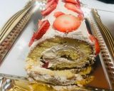 A picture of step 8 of Lotus biscoff strawberry Swiss roll cake.