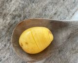 A picture of step 2 of Hasselback truffle roasted potatoes.