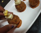 A picture of step 5 of Puliyogare cheese burst bombs in pizza sauce.