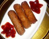 A picture of step 5 of Chicken Franks Bread Roll😋👌.