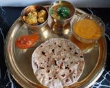 A picture of step 4 of Sukhi Bhaaji Khati meethi dal and fulka roti - a Gujarati Thali.