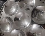 A picture of step 5 of Choco Idli Muffins by Oreo biscuits.