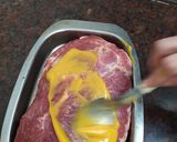 A picture of step 2 of Pork Shoulder with Mustard, Spiced Plums, and Orange Sweet Potato Mash.