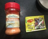 A picture of step 3 of Cheesy masala popcorn.