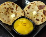 A picture of step 10 of Oats Paneer stuffed coin paratha with Aamras.