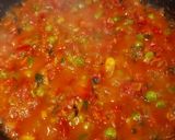 A picture of step 4 of Shakshuka (In my style- Poached eggs in tomato and veggie gravy).