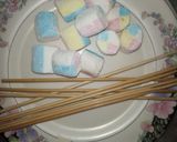 A picture of step 2 of 1 bite chocolatey marshmallow pops.