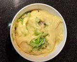 A picture of step 3 of Moong and Chana Hummus on toasted bread.