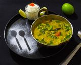 A picture of step 6 of Lasooni Dal Palak with Gondhoraj lebu/ lemon.