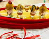 A picture of step 4 of Vermicelli PASTA bombs served with Strawberry custard sauce.
