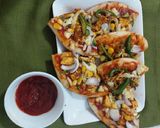 A picture of step 3 of Paneer tikka pizza.