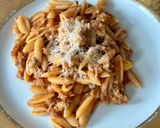 A picture of step 6 of Malloreddus alla Campidanese (pasta with saffron, tomato and pork sausage ragù).