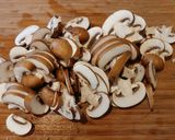 A picture of step 5 of Pan Seared Chicken Breast smothered in a Crimini Mushroom Sauce.