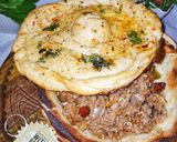 A picture of step 3 of Qeema with bowl Naan.