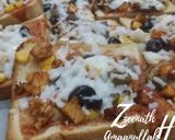 A picture of step 3 of Oven Baked Chicken Loaded Bread Pizzas.
