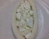 A picture of step 3 of Khachapuri with four cheese.