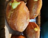 A picture of step 15 of Donuts filled with vanilla custard ice.