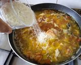 A picture of step 7 of Chicken and Squid Paella.