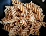 A picture of step 1 of Veg Pasta with Egg and flavoured bacon bits carrot chips + Dip.