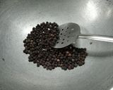 A picture of step 1 of Rasam Masala.