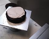 A picture of step 1 of 8 inch tall chocolate brownie cake.
