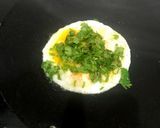 A picture of step 5 of Omelette with green coriander 🥚🥬🥬.