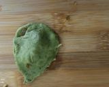 A picture of step 11 of Spinach Corn Ravioli in white sauce.