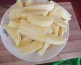 A picture of step 1 of Rosemary baked potato wedges.