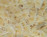 A picture of step 1 of Farfalle Pasta with cheese & Schezwan sauce.