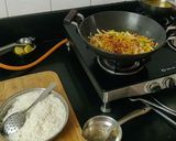 A picture of step 5 of Jain Pav bhaji sizzlar.