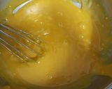 A picture of step 6 of Mango Blondie Bars with M&Ms.