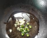 A picture of step 2 of Masaledar bhindi.
