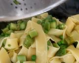 A picture of step 10 of Pappadelle Pasta with Asparagus, Saffron + Peas.
