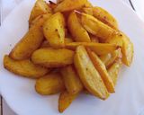 A picture of step 5 of Baked turmeric potato wedges.