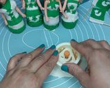 A picture of step 3 of Ready-made cupcakes with Fondant topper independence day theme.