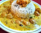 A picture of step 10 of Kadhi pakoda with boiled rice.