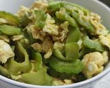 A picture of step 12 of Bitter gourd with egg.