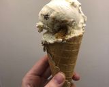 A picture of step 11 of Vanilla bean ice cream with ginger biscuits, caramel and chocolate.