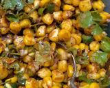 A picture of step 4 of Jacket Potatoes with Buttery Corn Chaat Stuffing.
