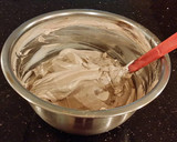 A picture of step 10 of Hazelnut Layer Cake with Hazelnut Cream Frosting.