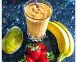 A picture of step 1 of Mango Smoothie with banana strawberry & Greekyogurt.